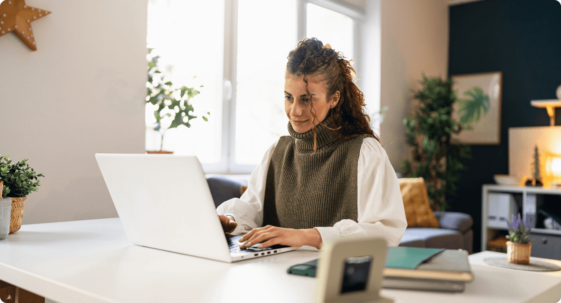 woman working on her laptop in a seasonal home