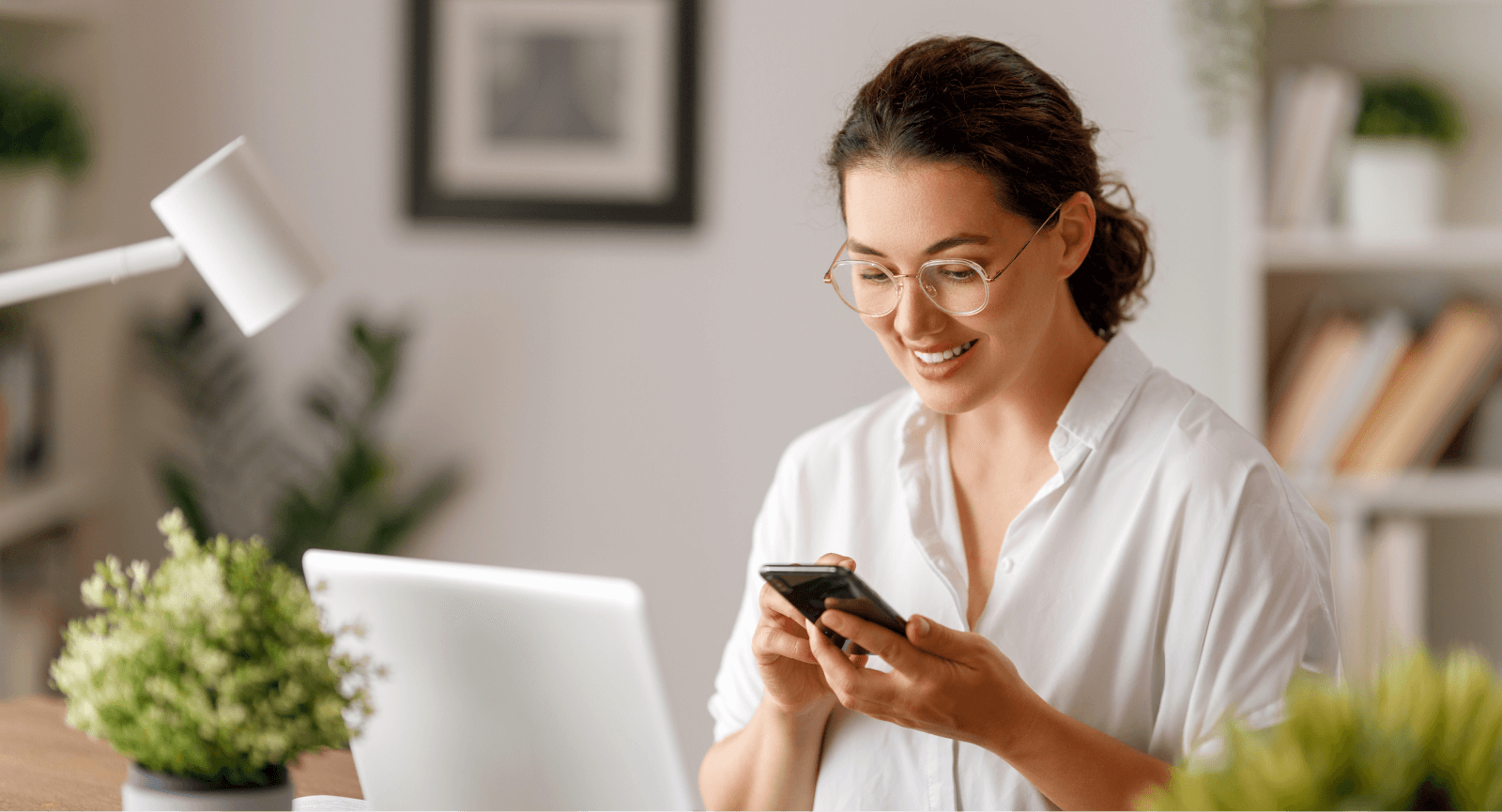 Happy woman holding phone