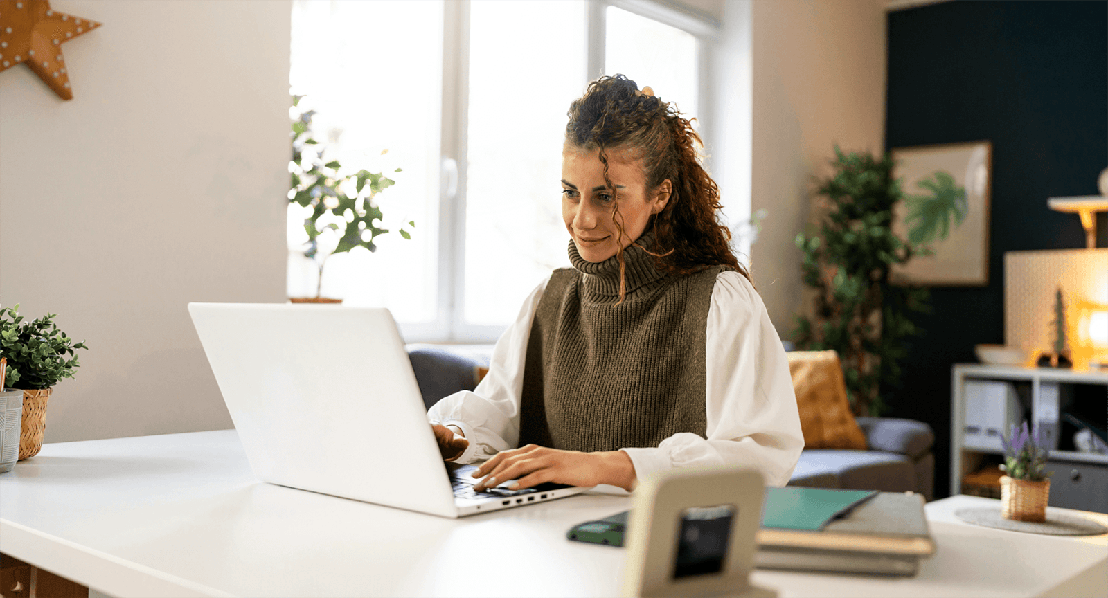 Businesswoman sending gift cards to her employees