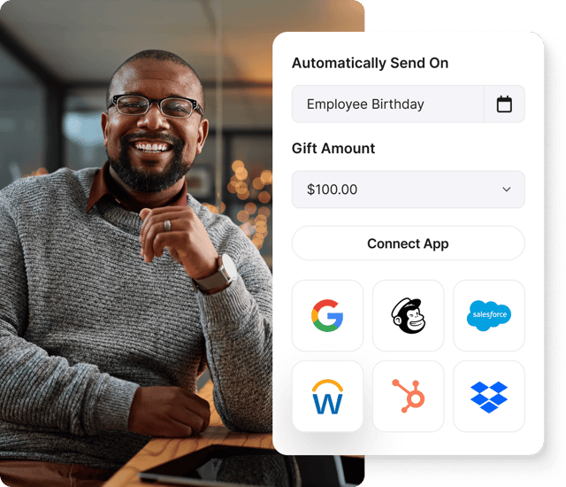 Smiling man next to Giftogram screen showing automated employee birthday gifts and app integrations for appreciation.