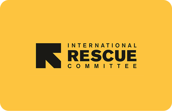 International Rescue Committee logo with a black arrow-like design and text on a yellow background.