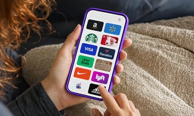 A person picking a gift card brand on their phone