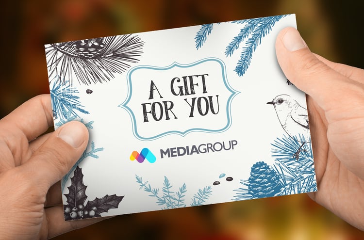 Customer holding holiday gift card