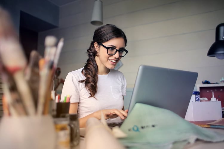 Woman at laptop taking an online class