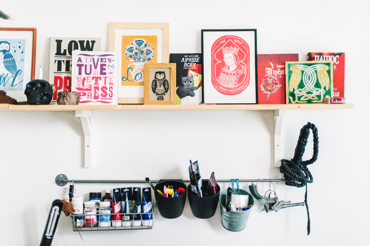 Items purchased with a gift card lined up on employee's desk 