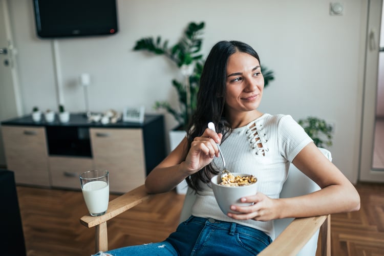 An engaged newsletter reader at her apartment