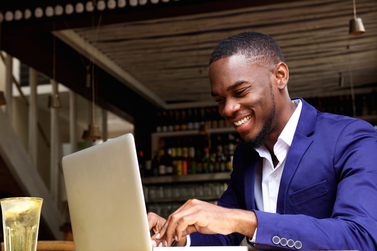 A man working on his submission for a business newsletter contributor program 