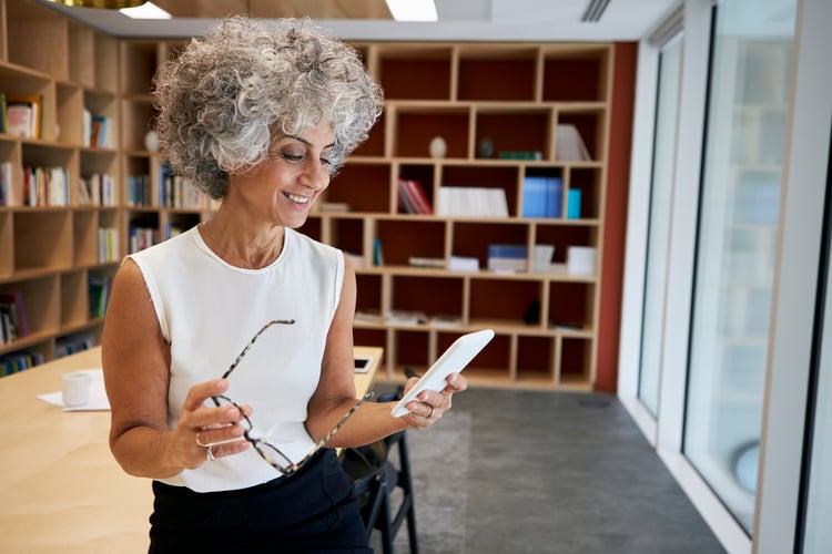 a woman reading an email from a content marketing drip campaign