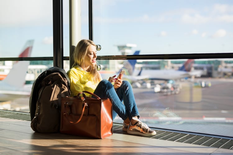 Woman waiting, excited at the airport