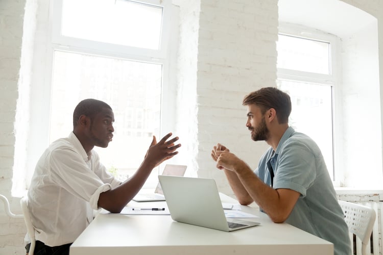 A manager meeting with an employee about his career path