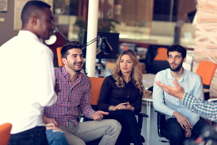 a diverse group of employees at a meeting