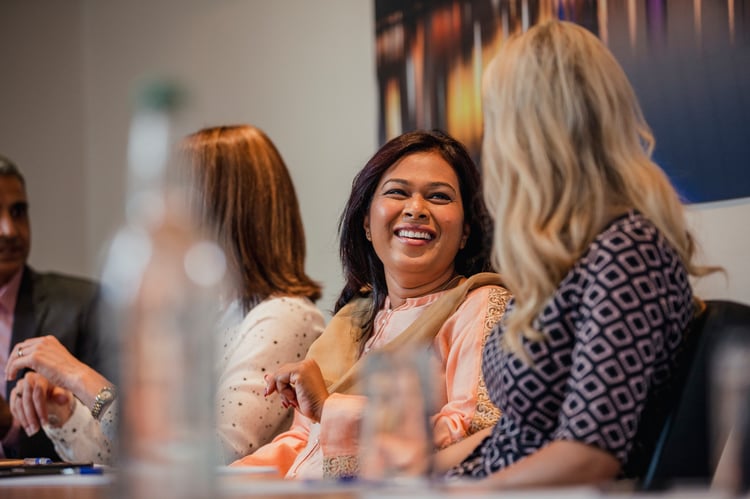 Female co-workers having conversation