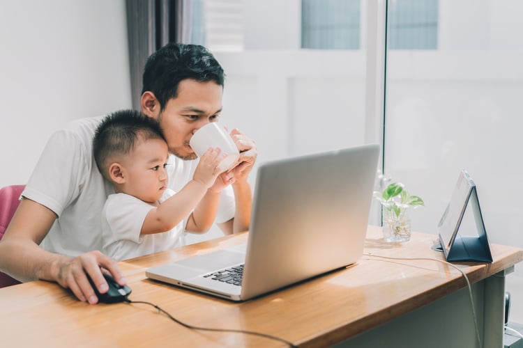 A father working from home with his son