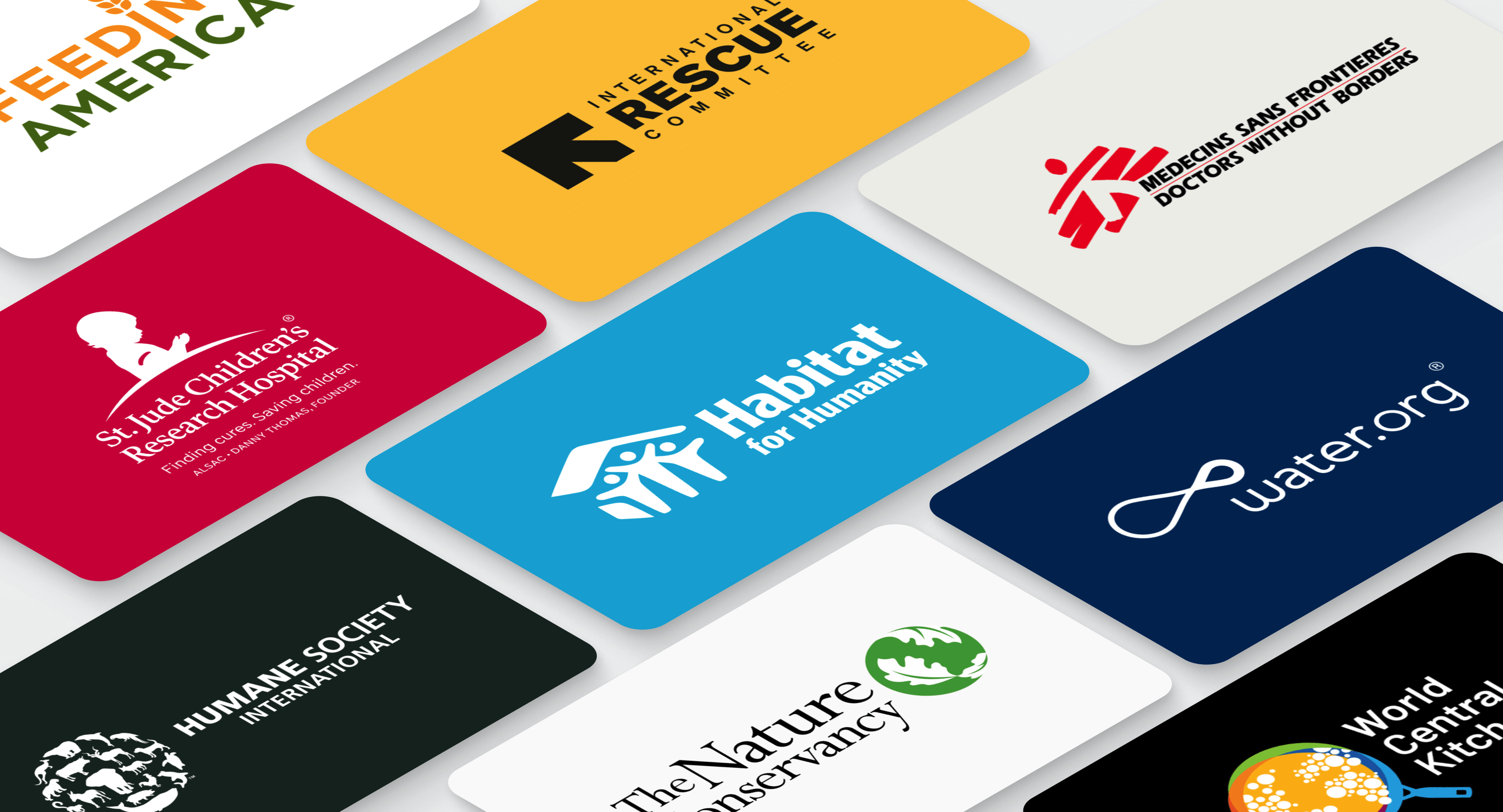 A grid of various charity logos on gift cards, including St. Jude, Habitat for Humanity, and Water.org, representing Giftogram's giving options.