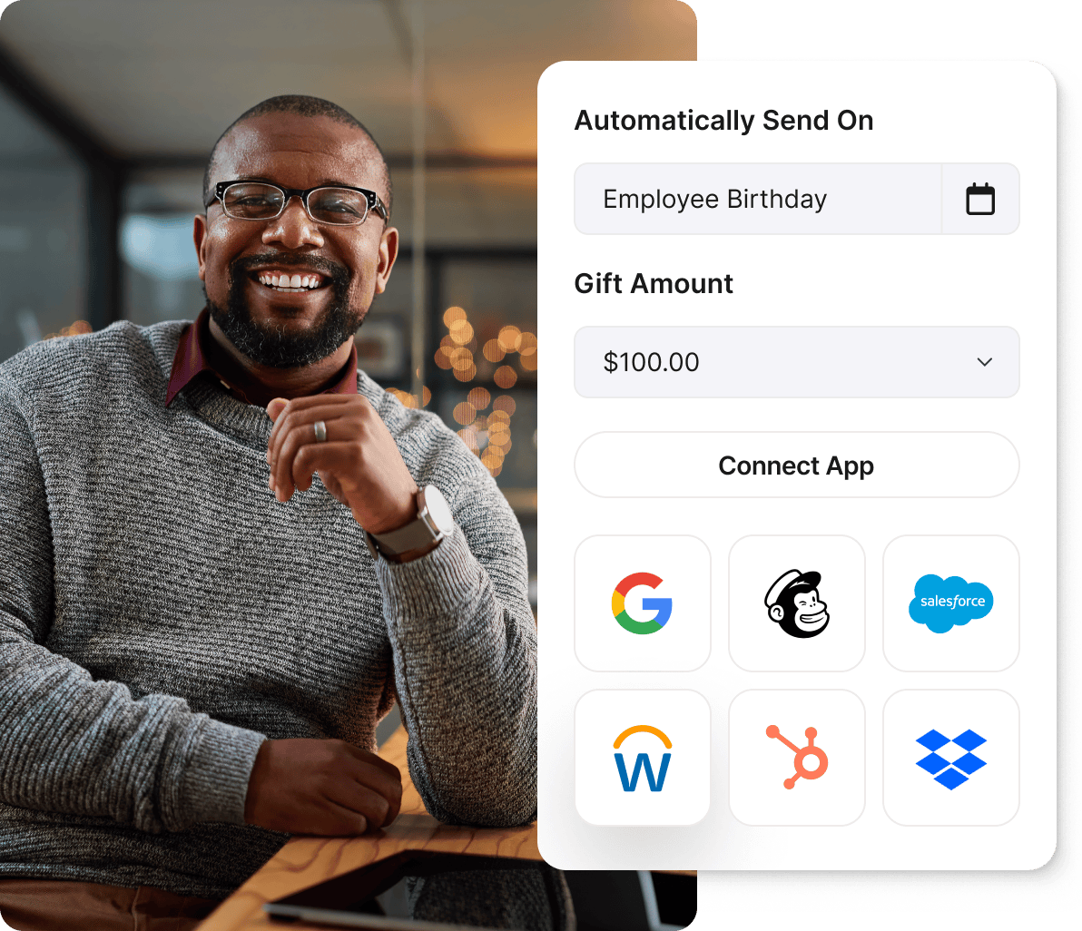 Smiling man next to Giftogram screen showing automated employee birthday gifts and app integrations for appreciation.
